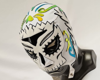May include: White wrestling mask with a skull design and colourful floral accents. The mask has a black eye mask and a white strap.