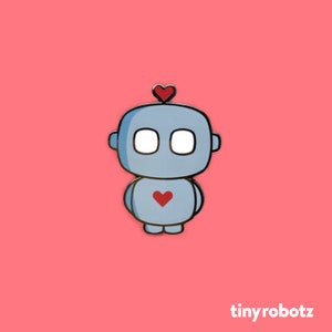 Puede incluir: Un robot azul con un corazón rojo en el pecho y un corazón rojo en la cabeza. El robot tiene ojos blancos y un contorno negro.