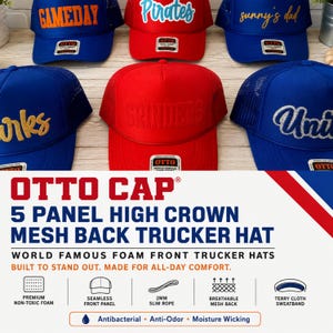 May include: A collection of five-panel high crown mesh back trucker hats by Otto Cap in various colors including blue and red. The hats feature foam fronts with embroidered text such as GAMEDAY, Pirates, sunny's dad, and GRINDERS. Each hat has a structured front panel, a mesh back, and a slim rope detail across the base of the crown.
