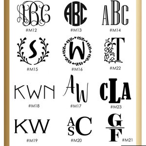 May include: A sheet of paper with 10 different monogram designs in black. The designs include letters in various fonts and styles, including a wreath, a script font, and a block font. The designs are numbered M12 through M23.