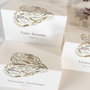 Naamkaartjes bruiloft, botanische gevouwen tafelkaarten met bloemrijk hart, gepersonaliseerde zitkaarten met minimale bloemenillustratie