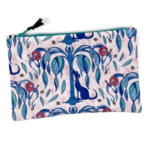 May include: A pink and white canvas zippered pouch with a blue and green tree design. The tree has blue leaves and a blue dog standing next to it. There are red squirrels climbing the tree.