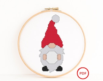 Santa Hat Gnome holding a Snowball Cross Stitch Pattern