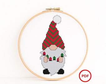 Christmas Gnome holding a Christmas Lights Cross Stitch Pattern