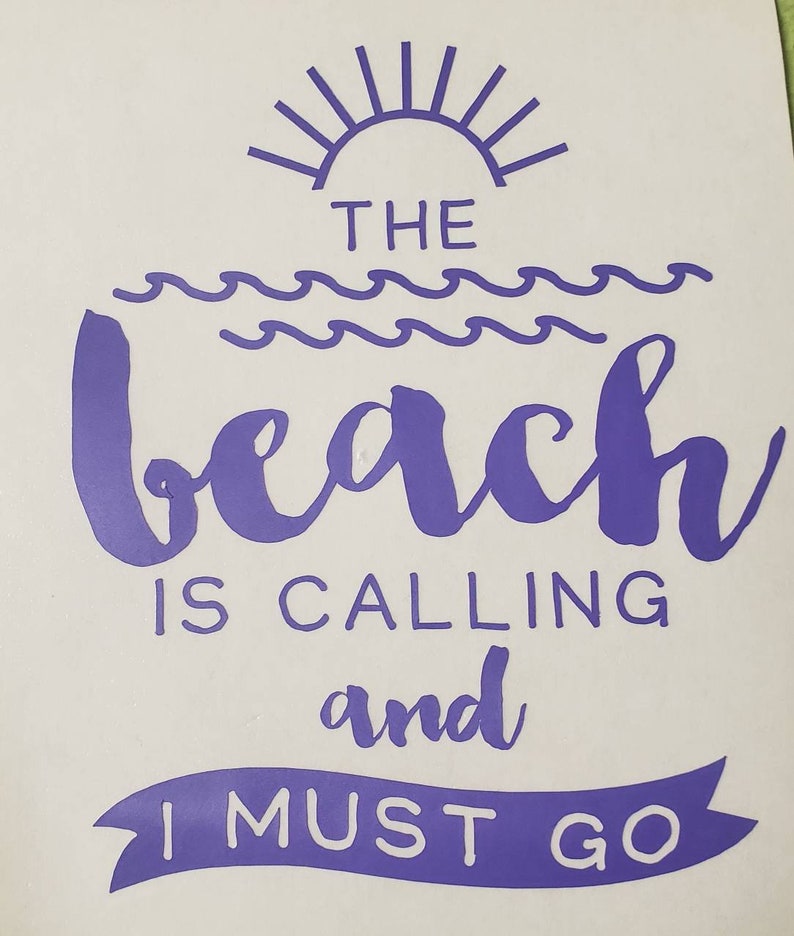 May include: A white background with purple text that reads "THE BEACH IS CALLING and I MUST GO." The design includes a sun, waves, and a banner. This image is perfect for beach lovers.