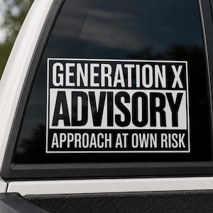 May include: A rectangular vinyl decal applied to a vehicle window featuring a white border and white text on a black background. The text reads GENERATION X in the top section, ADVISORY in the middle, and APPROACH AT OWN RISK at the bottom.