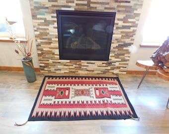 Beautiful old Navajo Rug with feathers and water bugs