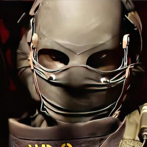 May include: A close-up of a person wearing a dark gray helmet and face covering with eye openings. The helmet has attached ear pieces and wires. A black and yellow device is attached to the person's shoulder.