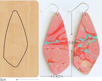 May include: A wooden template for making earrings, with two outlined shapes for cutting out the earrings. The template is 7.6 cm by 7.6 cm. The template is labeled "YT0771". The image also shows a pair of finished earrings made from the template, which are 5.6 cm long and 2.4 cm wide. The earrings are pink with red and blue marbling.