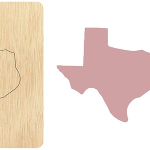 May include: A wooden cutout of the state of Texas. The cutout is on a light brown wooden background.