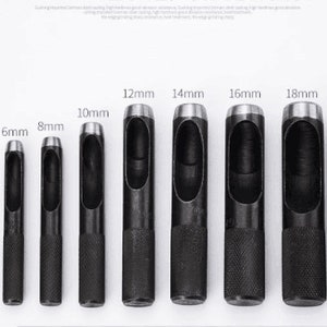 May include: Set of 10 black metal hole punch tools with different sizes ranging from 2mm to 20mm. The tools have a silver-colored metal tip and a black rubber handle.