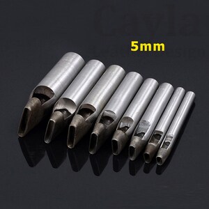 May include: Set of eight metal leather hole punches with oval-shaped blades. The punches are arranged in order of size, with the largest punch on the left and the smallest punch on the right. The largest punch is labeled "5mm".