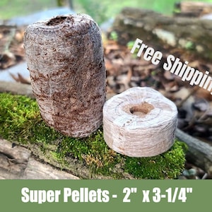 May include: Two brown Super Pellets for gardening, one cylindrical and one round, resting on a moss-covered log. The cylindrical pellet is approximately 3.25 inches tall and 2 inches wide. The round pellet is 2 inches in diameter.