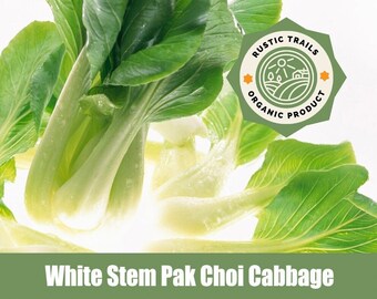 May include: A bunch of fresh, green white stem pak choi cabbage with white stems. The cabbage is arranged in a cluster with the leaves fanned out. The image has a green and white color scheme. The text "RUSTIC TRAILS ORGANIC PRODUCT" is on a green label with a yellow star.