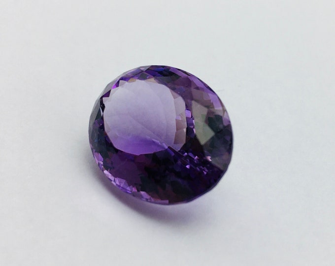 Amethyst cut stone/ oval shape/ width 14.91mm/ length 18.72mm/ height 10.22mm/ weight 16.65 carat/ price 97.00 us dollar/ natural gemstone