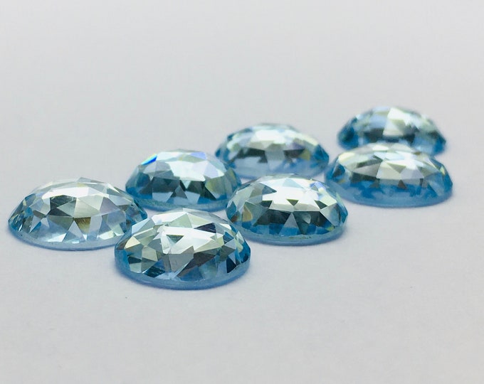 Blue topaz cabochon cut on top/ size 12mm to 13.50mm/ round shape/ piece 1/ 6.85 carat/ price 51.85 usa dollar per piece/ amazing blue topaz