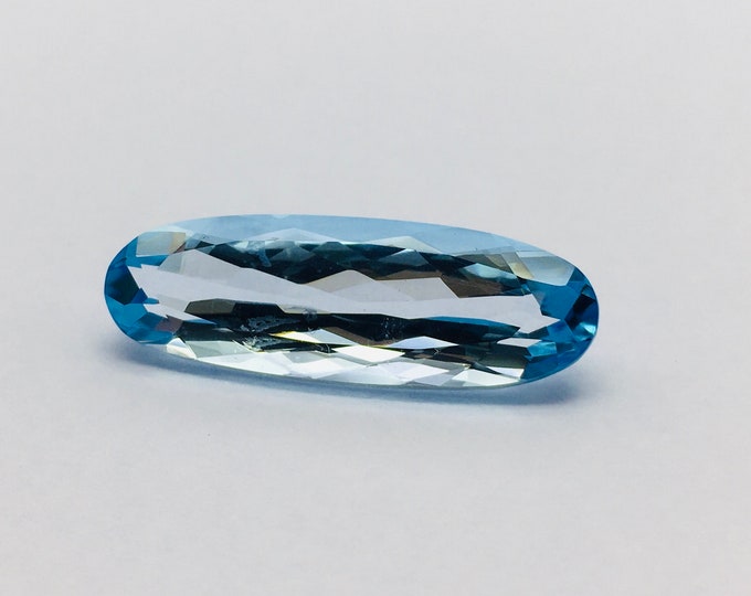 Blue topaz cut stone/ width 10.00mm/ length 30.00mm/ height 7.00mm/ shape oval/ piece 1/ weight 19.35 carat/ price 225.00 usa dollar/ rare