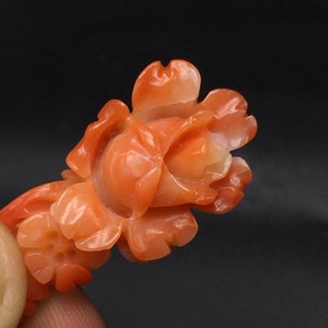 Natural RED CORAL/Hand carved FLOWER/Width 16MM/Lenth 35MM/Height 8MM/Weight 22.90 carats/Beautiful deep red color/Flower carving/Fancy