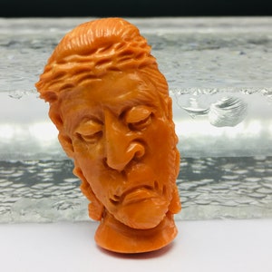 Natural CORAL/Hand carved FACE/Width 20MM/Length 38MM/Height 7MM/Weight 35.70 carats/Beautiful deep orange color/Face carving/Fancy carving