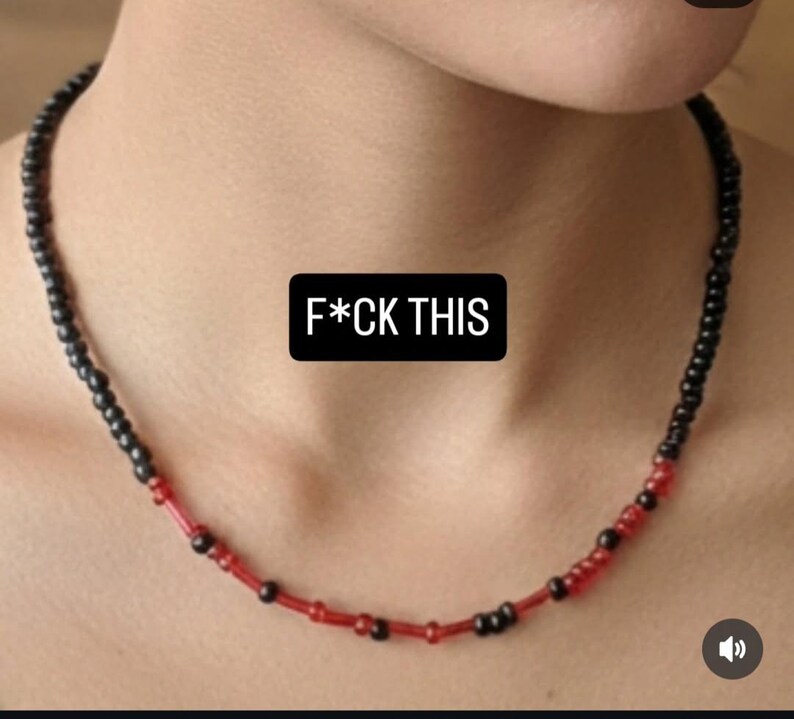 May include: A necklace made of black and red beads. The image includes the text "F*CK THIS" in white font on a black background.
