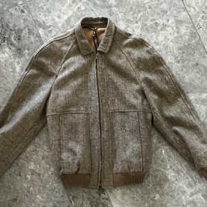 Love this one! 1970s men’s wool zip up bomber jacket! Made in Australia.