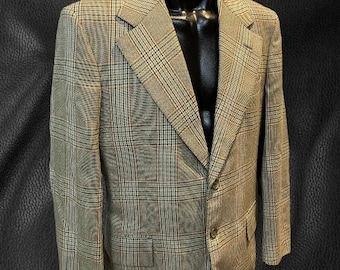 May include: A brown, beige, and black plaid blazer with a single button closure.