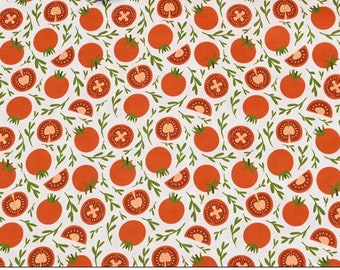 May include: White fabric with a repeating pattern of red tomatoes and green leaves. The tomatoes are whole and sliced in half.