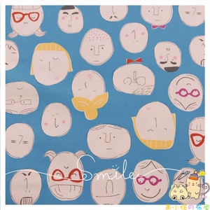 May include: A blue fabric with a repeating pattern of white outlined faces with different expressions. The faces have various features, including glasses, mustaches, and bows. The text "Smile" is written in white on the fabric.
