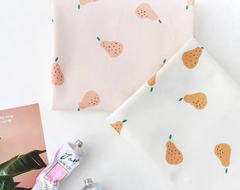 May include: Two pieces of fabric with a pear print. One fabric is pink with brown pears and the other is white with orange pears.