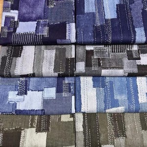 May include: A collection of six fabric swatches featuring a patchwork design with various shades of blue, gray, and brown. Each piece displays a grid of rectangular patterns accented by white dashed stitching lines that mimic a hand-sewn look.