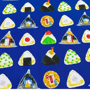 May include: A pattern of various onigiri rice balls on a blue background. The onigiri feature different fillings and toppings, including peas, red berries, and shrimp tempura. Some are wrapped in nori seaweed, and some have Japanese text.