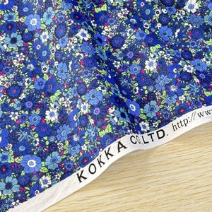 May include: Blue floral fabric with a white label that reads "KOKKA CO., LTD. http://www.kokka.co.jp"