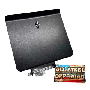 May include: Black metal plate with a small latch and a silver metal rod with hardware. The plate has a textured surface. The text "ALL STEEL OFF-ROAD" is printed on a red, white, and blue American flag.