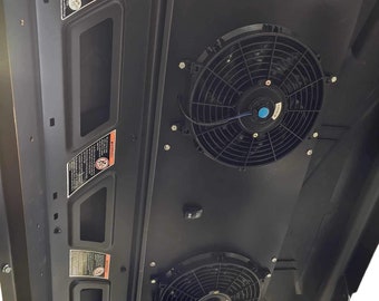 May include: A black metal roof panel with two black fans and a black switch. The panel has a sticker that says "ALL STEEL OFF-ROAD".