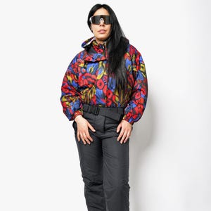 90s vintage ski suit black multi colour women&#39;s | Winter retro 80s skiing jumpsuit | Abstract patterned snow one piece overall | Small size