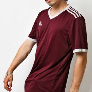 Y2K ADIDAS v-neck sports shirt for men in maroon red colour.