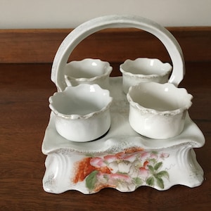Vintage four egg cup ceramic cruet with decorative finish