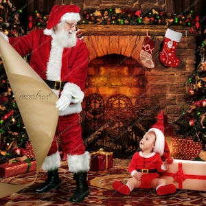 May include: Santa Claus in a red suit and white beard is holding a rolled up piece of brown paper with the text "neverland digital arts" on it. A young child dressed as Santa is sitting on the floor in front of him. There is a fireplace with stockings hanging from it and a Christmas tree in the background.