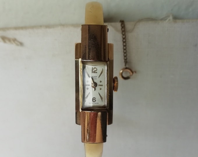montre de dame Cauny prima mécanique des années 40, métal doré, bracelet ancien