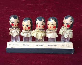 anciens et petits flacons à parfum anciens, bouchons têtes de poupées, floral quintuplets de Karoff