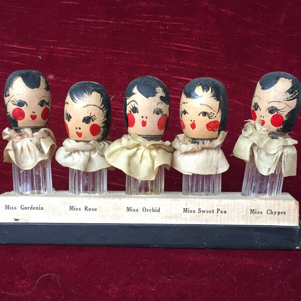 anciens et petits flacons à parfum anciens, bouchons têtes de poupées, floral quintuplets de Karoff
