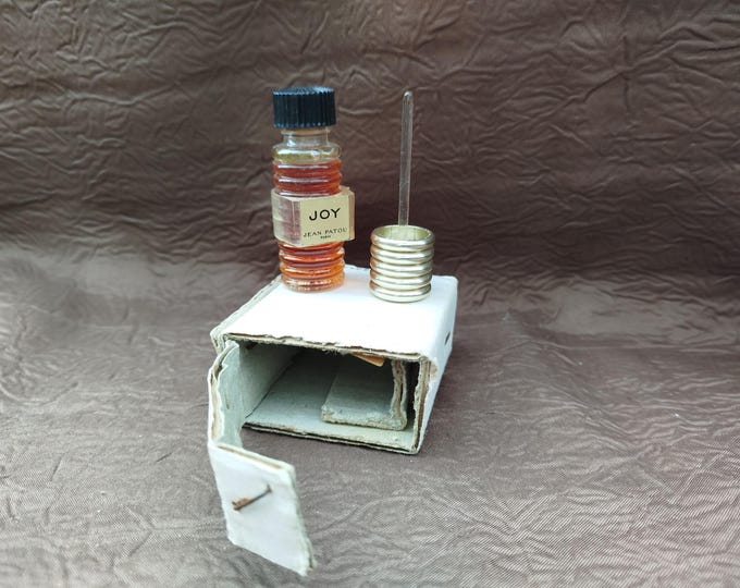 ancien flacon parfum Joy de Jean Patou, touche oreille démonstration