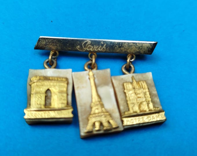 broche ancienne publicitaire monuments de Paris, notre Dame, Tour Eiffel et arc de triomphe