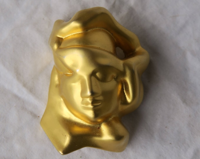 broche bijou parfum eau du soir, tête de femme en métal doré