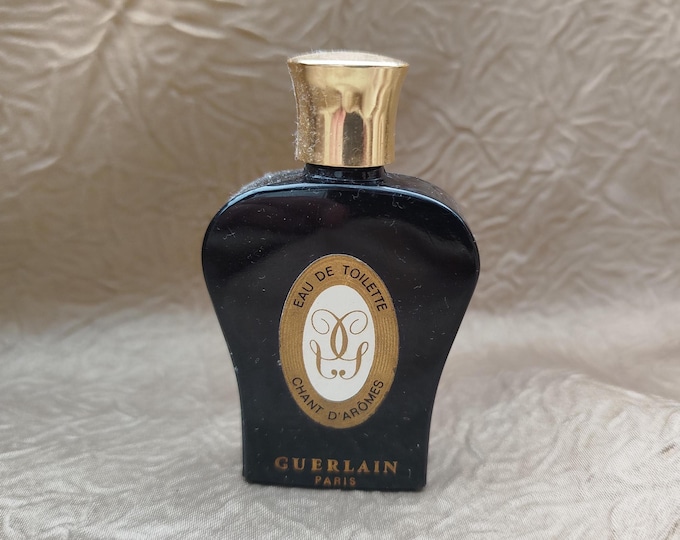 ancien flacon à parfum lyre noire de Guerlain, eau de toilette champs d'arôme, verre noir