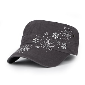 May include: A black canvas baseball cap with a floral design made of rhinestones.