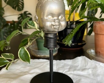 Vintage Doll Head on Stand Makes an Interesting Display Piece, No?