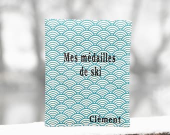 Pochette pour medailles de ski éventail paon