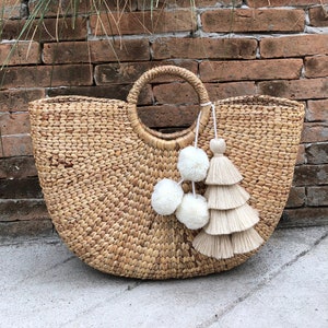 Makeover Your Plain Wicker Beach Tote With a Skien of Pompom Yarn