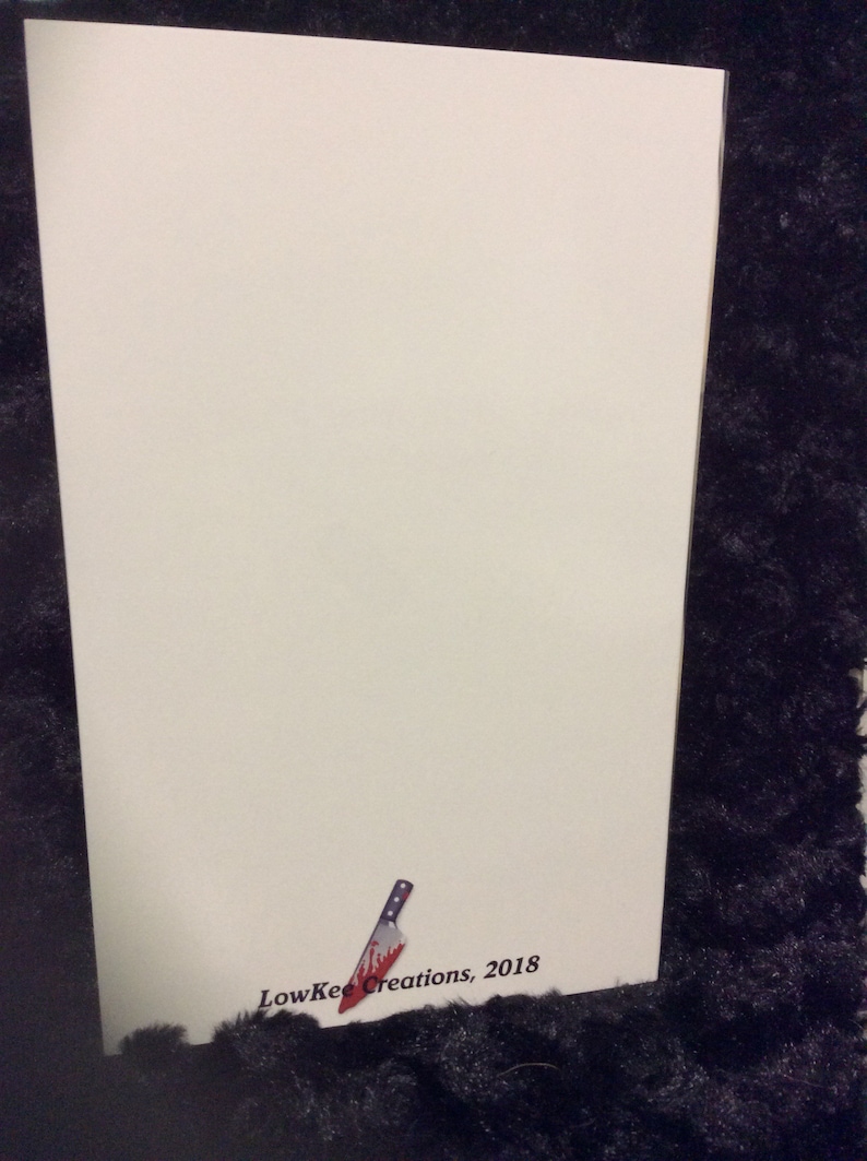May include: A white card with a small, red-stained knife illustration and the text "LowKee Creations, 2018" in black.
